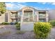 Two-story building exterior with landscaping and balconies at 2130 Sealion Dr # 207, Las Vegas, NV 89128
