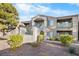 Building exterior with landscaping and balconies at 2130 Sealion Dr # 207, Las Vegas, NV 89128