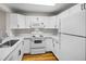 White kitchen with stainless steel appliances at 2130 Sealion Dr # 207, Las Vegas, NV 89128