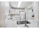 Modern kitchen with white cabinets and quartz countertops at 2130 Sealion Dr # 207, Las Vegas, NV 89128