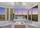 Sun-filled living room featuring floor-to-ceiling windows with panoramic views of the city and stylish white furniture at 222 Karen Ave # 3307, Las Vegas, NV 89109