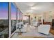 Inviting living room with floor-to-ceiling windows showcasing a stunning city view, modern furniture and decor at 222 Karen Ave # 3307, Las Vegas, NV 89109