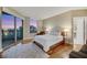 Bright bedroom with floor-to-ceiling windows, hardwood floors, and balcony access with city views at 222 Karen Ave # 3307, Las Vegas, NV 89109
