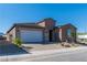 Lovely single-story home with stone accents, low-maintenance landscaping, and a paved driveway to the garage at 1005 Warsaw Ave, Henderson, NV 89015