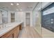 Spa-like bathroom with double vanity, large walk-in shower, and modern fixtures at 10254 Fairview Ridge Ct, Las Vegas, NV 89166