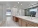 Elegant bathroom with double vanity, large mirror, and walk-in shower at 10254 Fairview Ridge Ct, Las Vegas, NV 89166