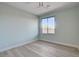 Light blue bedroom with wood-look floors and a ceiling fan at 10254 Fairview Ridge Ct, Las Vegas, NV 89166
