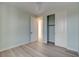 Light blue bedroom with wood-look floors, ceiling fan and closet at 10254 Fairview Ridge Ct, Las Vegas, NV 89166