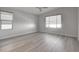 Bright bedroom with hardwood floors and large window at 10254 Fairview Ridge Ct, Las Vegas, NV 89166
