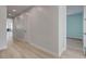 Bright hallway with light walls and wood-look floors at 10254 Fairview Ridge Ct, Las Vegas, NV 89166