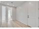 Light hallway with wood-look floors and access to bathroom at 10254 Fairview Ridge Ct, Las Vegas, NV 89166