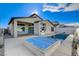 Single story home with a pool, spa, and outdoor kitchen at 10254 Fairview Ridge Ct, Las Vegas, NV 89166
