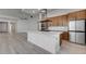 Modern kitchen with large island, stainless steel appliances, and hardwood floors at 10254 Fairview Ridge Ct, Las Vegas, NV 89166