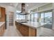 Modern kitchen with island, stainless steel appliances, and access to backyard at 10254 Fairview Ridge Ct, Las Vegas, NV 89166