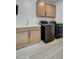 Bright laundry room with washer, dryer, and upper cabinets at 10254 Fairview Ridge Ct, Las Vegas, NV 89166