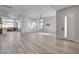 Bright and airy living room with wood floors and open floor plan at 10254 Fairview Ridge Ct, Las Vegas, NV 89166