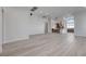 Open living area with light wood floors and kitchen views at 10254 Fairview Ridge Ct, Las Vegas, NV 89166