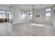 Bright living room with hardwood floors and ceiling fan at 10254 Fairview Ridge Ct, Las Vegas, NV 89166