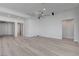 Spacious living area with hardwood floors and access to other rooms at 10254 Fairview Ridge Ct, Las Vegas, NV 89166