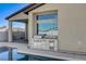 Built-in outdoor kitchen next to the pool and spa at 10254 Fairview Ridge Ct, Las Vegas, NV 89166