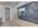 Spacious walk-in shower with blue tile and glass enclosure at 10254 Fairview Ridge Ct, Las Vegas, NV 89166