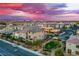 A view of a new construction neighborhood with modern houses and green spaces at 8021 Adelaide Hills St, Las Vegas, NV 89113