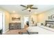Digitally staged bedroom features a ceiling fan, dresser, and comfortable carpeting at 8021 Adelaide Hills St, Las Vegas, NV 89113