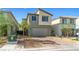 Contemporary two-story home with a two-car garage and brick driveway on a sunny day at 8021 Adelaide Hills St, Las Vegas, NV 89113