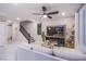 Comfortable living room with modern entertainment center and easy access to second floor at 8021 Adelaide Hills St, Las Vegas, NV 89113