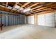 Spacious three-car garage with ample storage shelving at 2360 Greyhound St, Pahrump, NV 89060