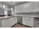 Well-lit kitchen with white cabinetry, stainless steel appliances, and a stylish backsplash at 1008 Domnus Ln # 103, Las Vegas, NV 89144