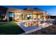Luxury backyard oasis with a pool, fire pit, and patio furniture at 7 Stoneshead Ct, Henderson, NV 89012