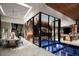 Elegant dining room with wine cellar feature at 7 Stoneshead Ct, Henderson, NV 89012