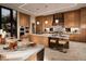 Modern kitchen with wood cabinets and marble countertops at 7 Stoneshead Ct, Henderson, NV 89012