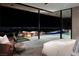Luxurious bedroom with access to a private patio and pool at 7 Stoneshead Ct, Henderson, NV 89012