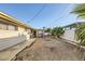 Backyard view showcasing gravel, concrete, and palm trees at 3187 Silver Saddle St, Las Vegas, NV 89169