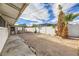 Large backyard with gravel, mature palm trees, and shed at 3187 Silver Saddle St, Las Vegas, NV 89169