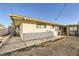 Home's exterior and backyard with gravel and concrete at 3187 Silver Saddle St, Las Vegas, NV 89169