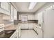 Efficient kitchen featuring white cabinets and appliances at 3187 Silver Saddle St, Las Vegas, NV 89169