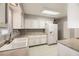 Kitchen with white cabinets and neutral countertops at 3187 Silver Saddle St, Las Vegas, NV 89169