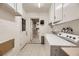 Laundry room with washer, dryer, cabinets and exterior access at 3187 Silver Saddle St, Las Vegas, NV 89169
