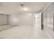 Living room with tiled floor and access to kitchen at 3187 Silver Saddle St, Las Vegas, NV 89169