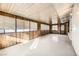 Bright sunroom with wood paneling and neutral flooring at 3187 Silver Saddle St, Las Vegas, NV 89169
