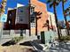 Exterior building with dedicated parking and well-maintained landscaping at 71 E Agate Ave # 207, Las Vegas, NV 89123