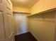 Interior view of the closet offering ample storage with clothing rods and shelves at 71 E Agate Ave # 207, Las Vegas, NV 89123