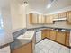 Kitchen with a breakfast bar, neutral counters, and appliances at 71 E Agate Ave # 207, Las Vegas, NV 89123