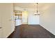 Cozy living area showcasing neutral tones, carpeting, and view into the adjacent kitchen at 71 E Agate Ave # 207, Las Vegas, NV 89123