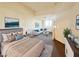 Staged main bedroom featuring a neutral color palette and an open floor plan at 71 E Agate Ave # 207, Las Vegas, NV 89123