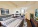 Staged main bedroom highlighting an open layout connecting the sleeping and sitting areas at 71 E Agate Ave # 207, Las Vegas, NV 89123