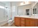 Bathroom with double vanity, bathtub, and window at 8152 Satin Carnation Ln, Las Vegas, NV 89166